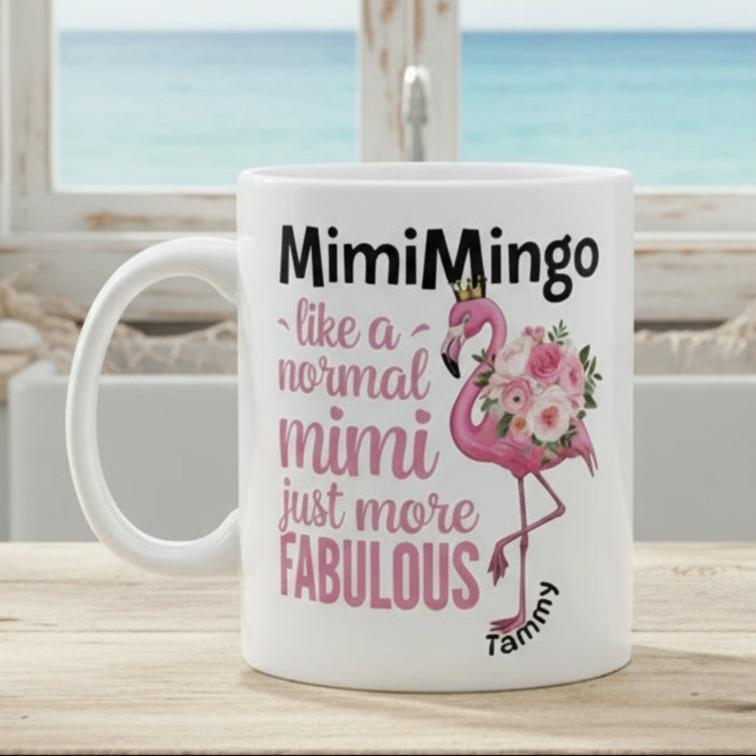 White mug with pink flamingo design and text on a white background