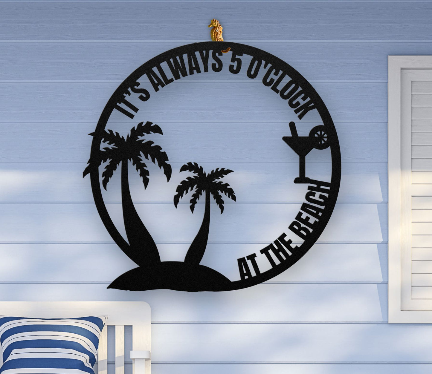 Black metal wall art featuring palm trees and a cocktail glass with the phrase "It’s 5 0’Clock Beach" in a playful beach theme, available in 6 sizes.
