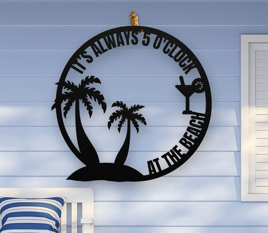 Black metal wall art featuring palm trees and a cocktail glass with the phrase "It’s 5 0’Clock Beach" in a playful beach theme, available in 6 sizes.