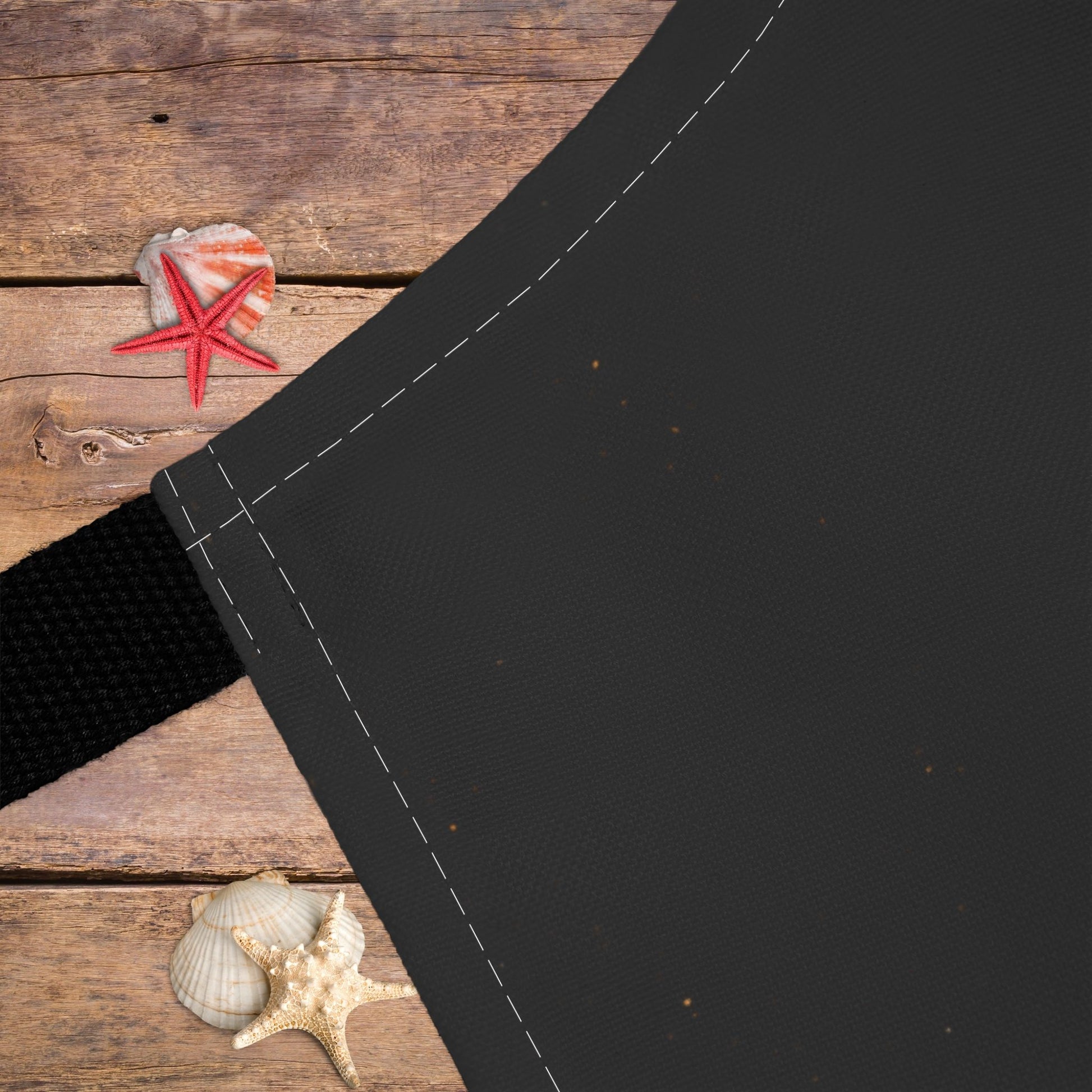 Close-up of black apron.