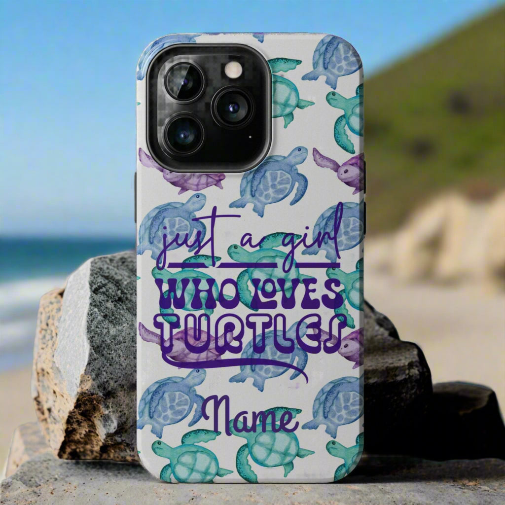 Phone case with sea turtle design and text 'just a girl who loves turtles' on a gray background
