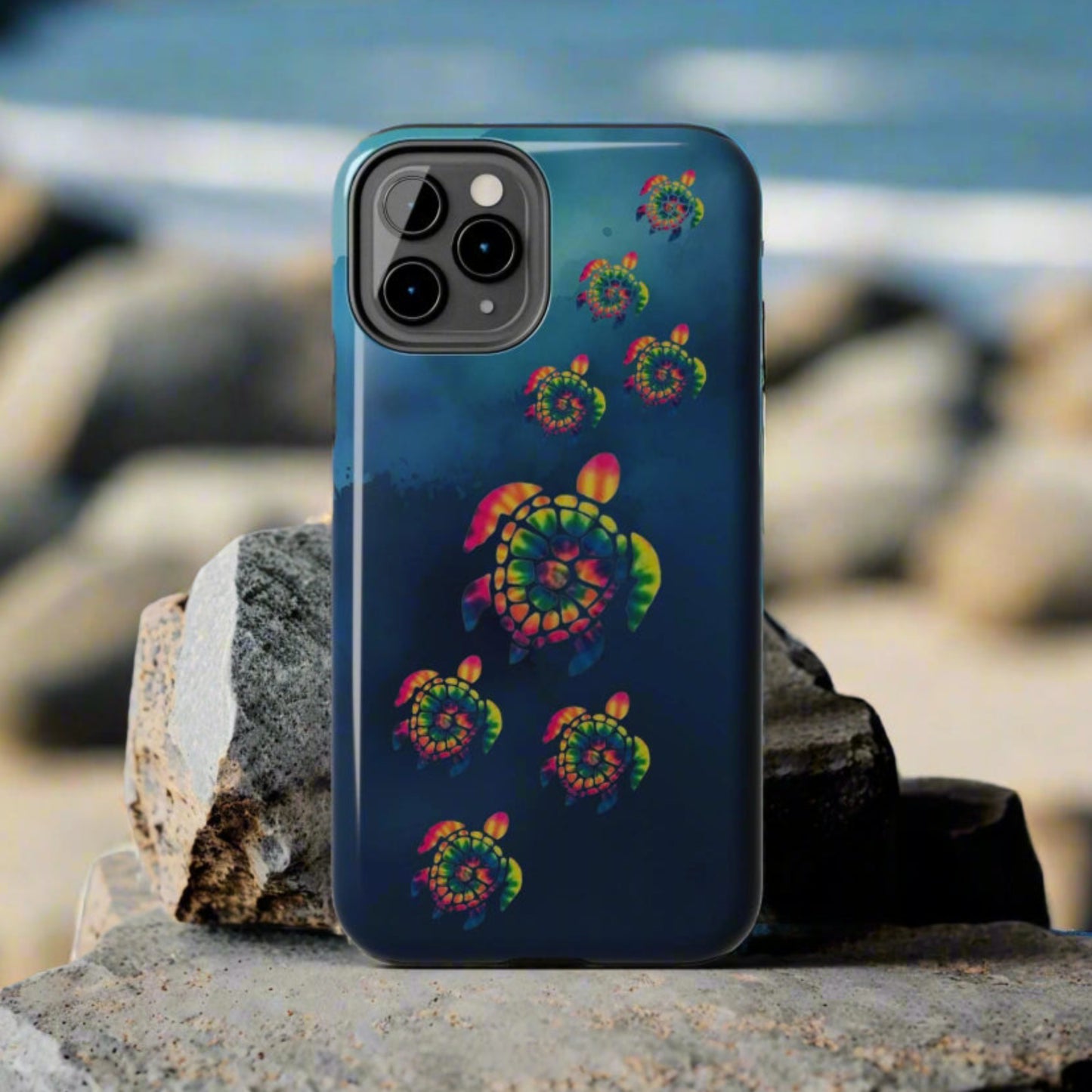 Phone case with colorful spiral design on a gray background