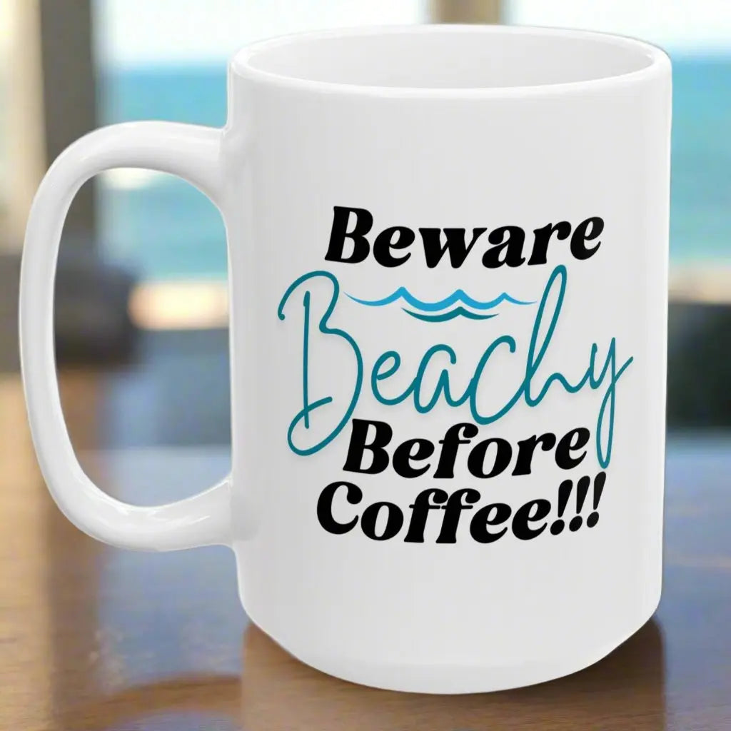 White 15 oz. coffee mug that says Beware Beachy Before coffee with wave image.