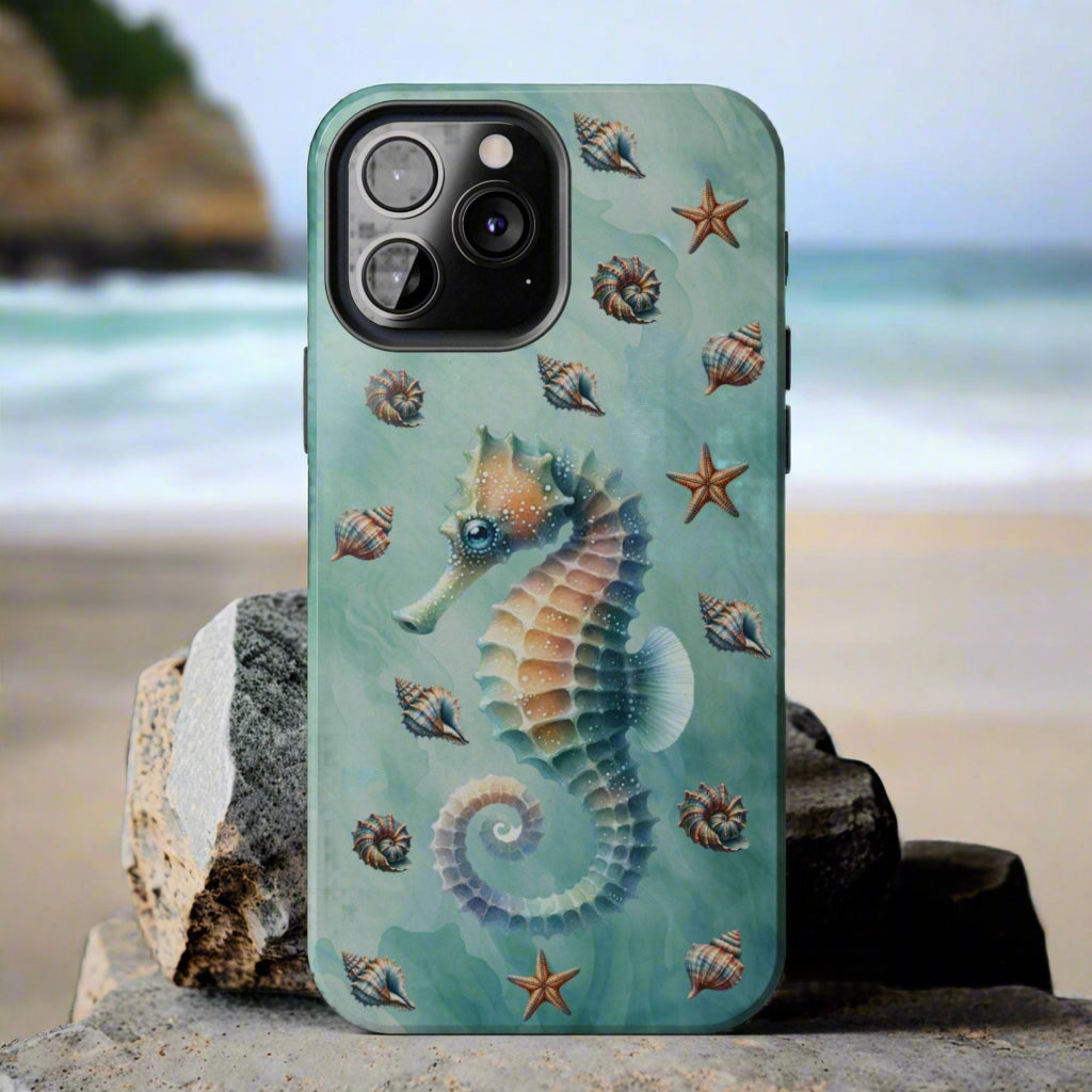 Phone case with seahorse and shell design on a green background