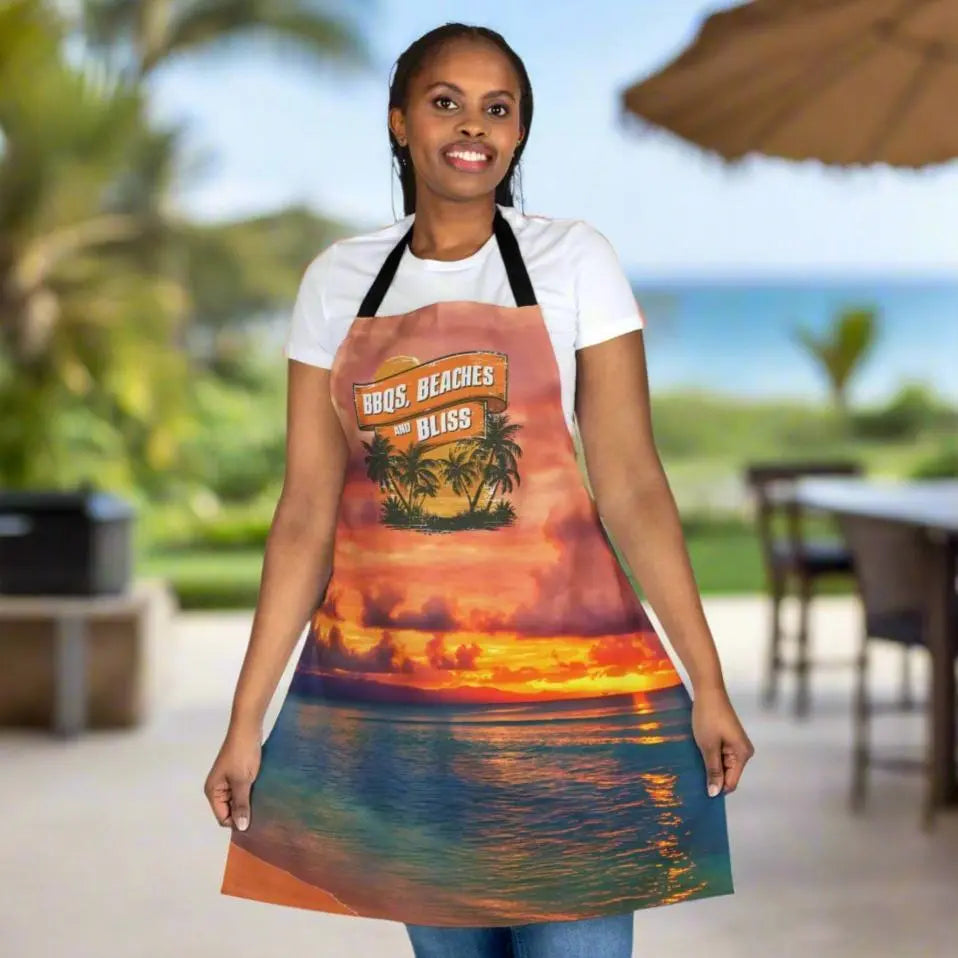 Person in Apron with sunset scene that says BBQ Beaches and Bliss