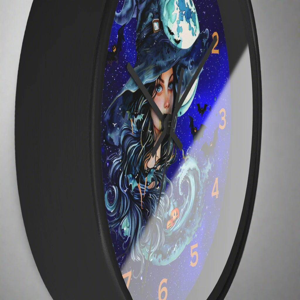 Wall clock with a witch design on a dark background