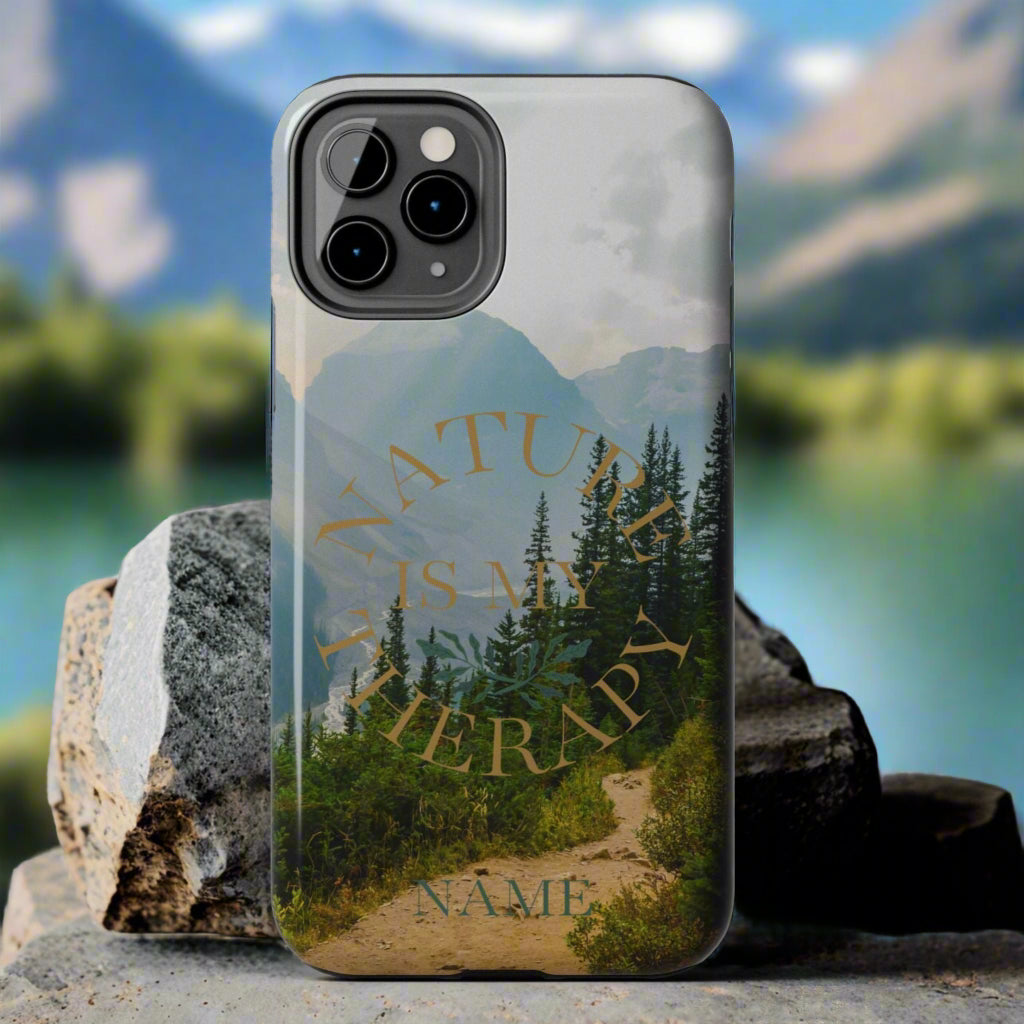 Phone case with nature design and 'Nature is my therapy' text on a gray background