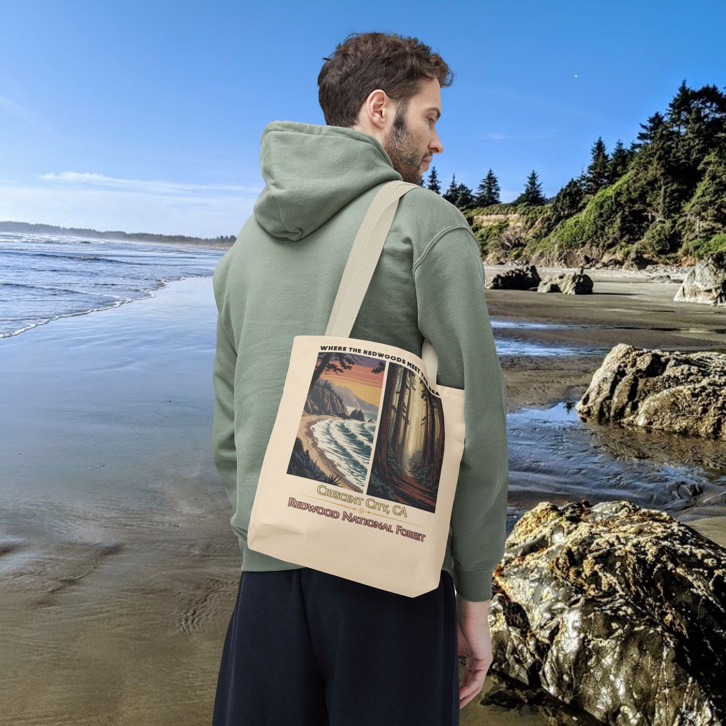 Beige 13" x 13" Tote bag with a double-panel design featuring the redwood forest and the Northern California coastline, with the text “Where the Redwoods Meet the Sea” and “Crescent City, CA Redwood National Forest” underneath.