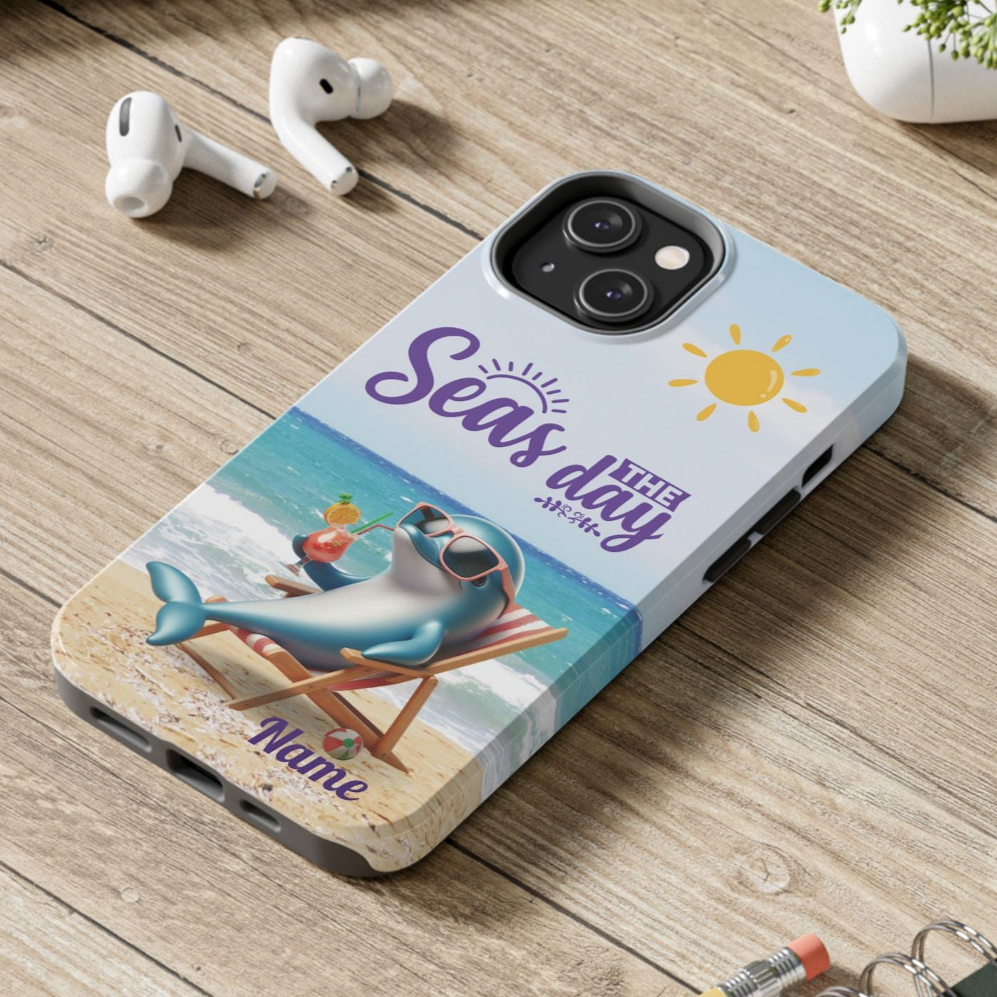Seas the Day dolphin-themed phone case with personalized name, glossy finish, and beach-inspired design with a dolphin enjoying a cocktail during a sunny day on the beach with the phrase Seas the Day.