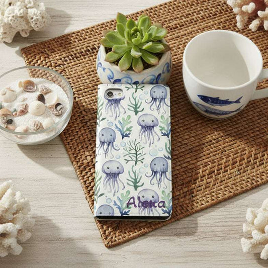 Phone case with jellyfish design on a gray surface