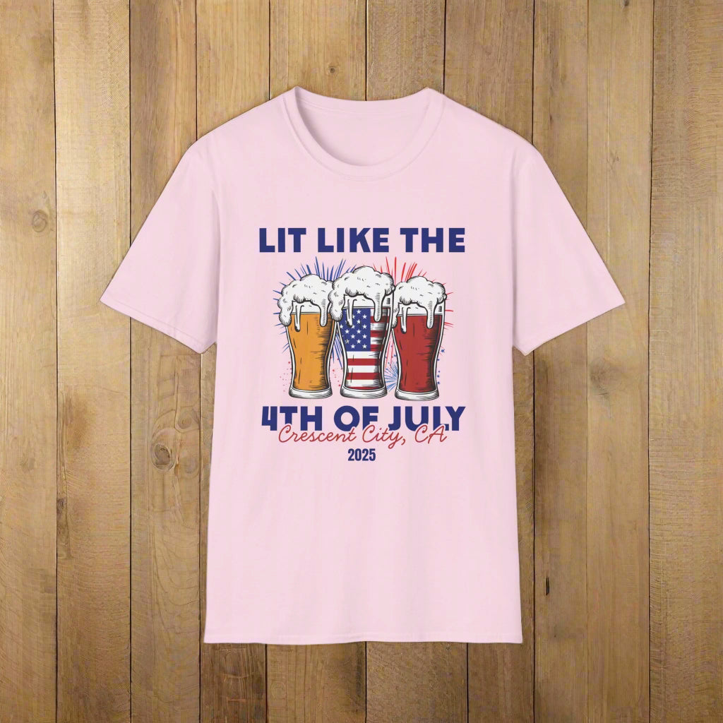 Pink t-shirt featuring three pint glasses—one filled with the American flag with slogan Lit Like the 4th of July Crescent City, CA 2025.