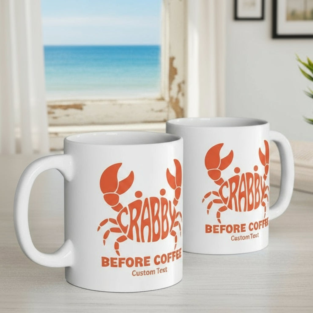 Two white mugs with red 'Crabby Before Coffee' design that can be personalized.