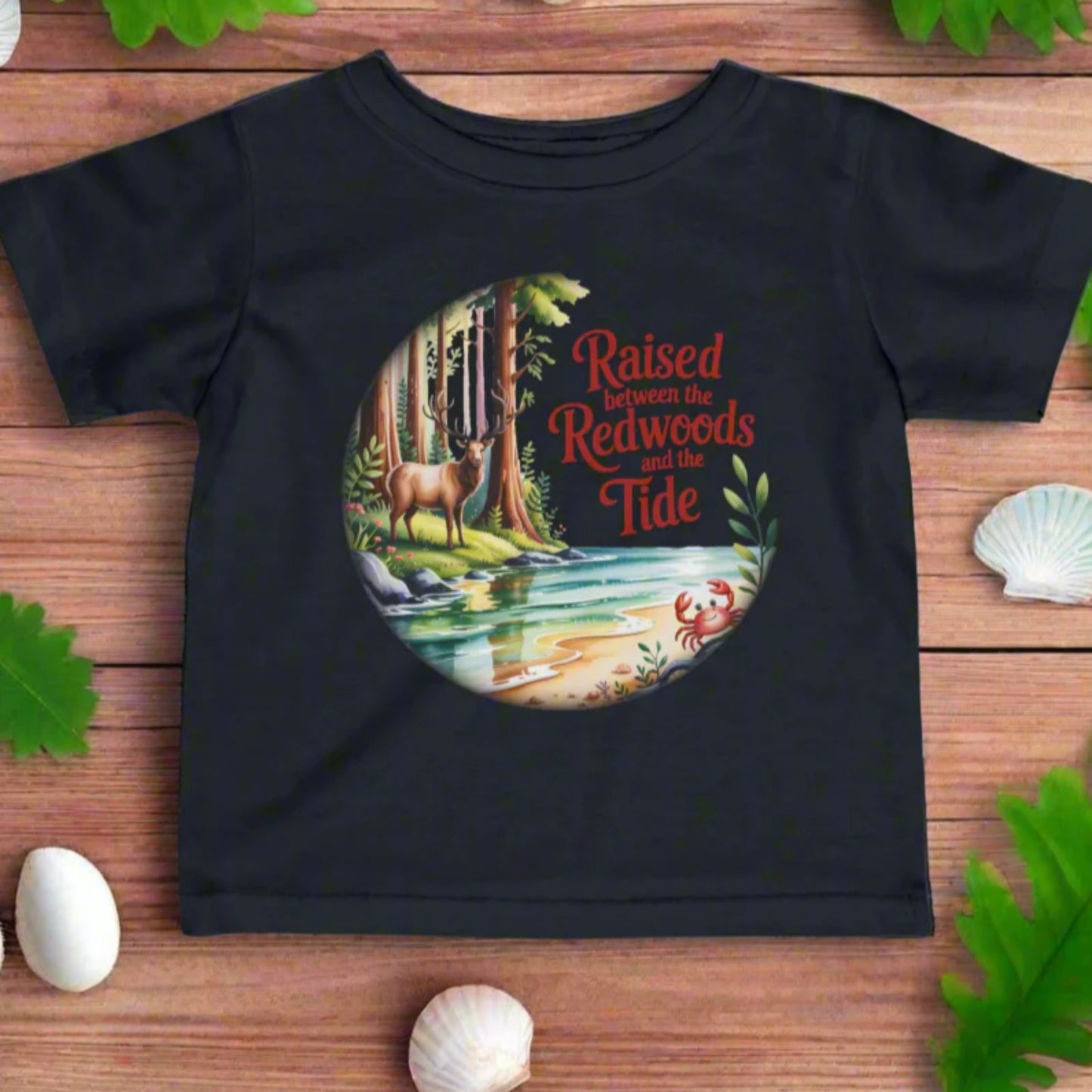 Black t-shirt with nature-themed graphic and text on a white background