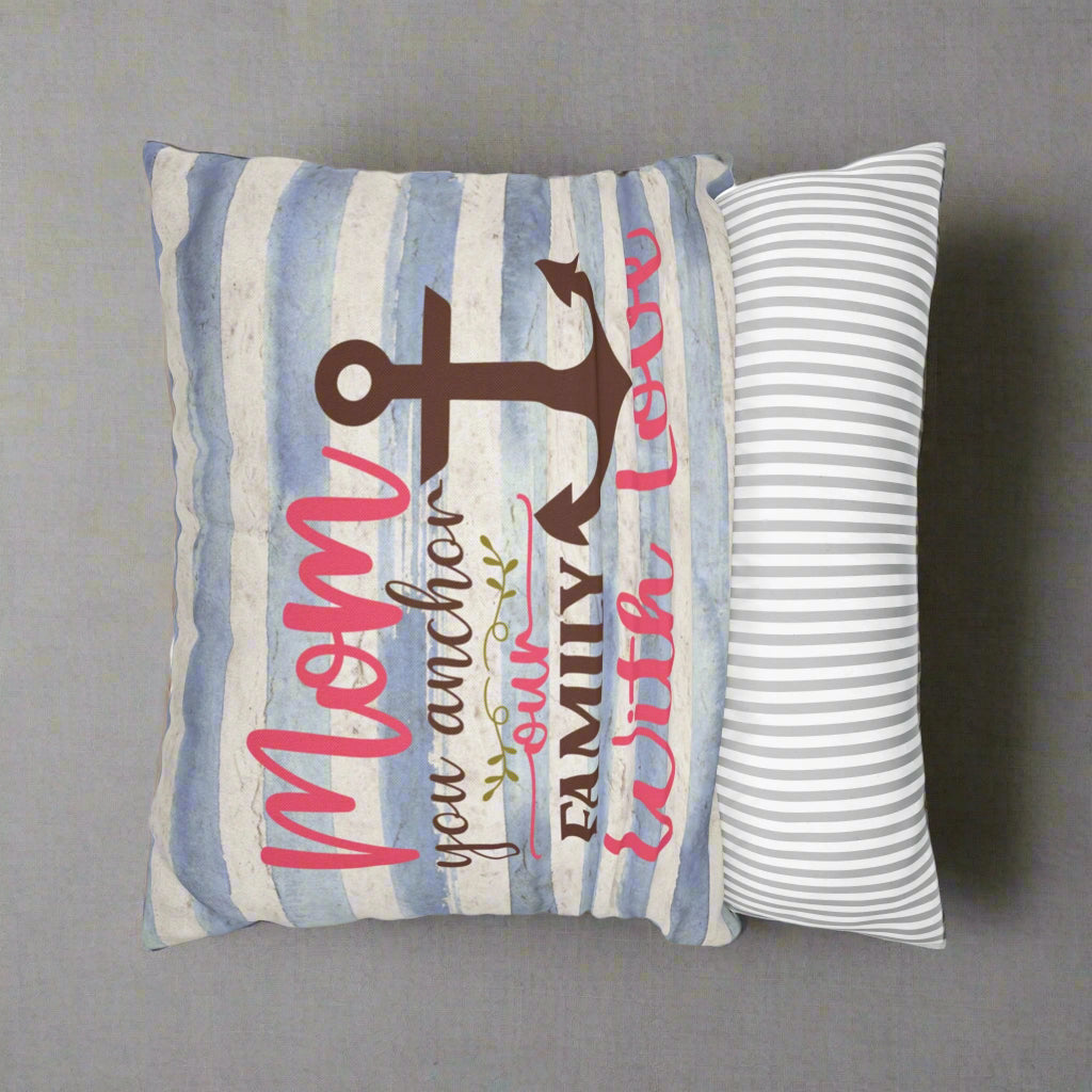Decorative pillow with anchor design and text on a striped background