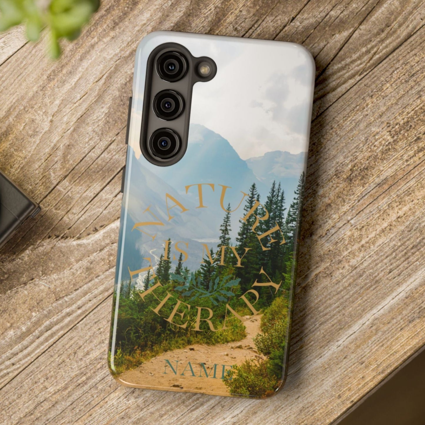 Phone case with nature design on a wooden surface