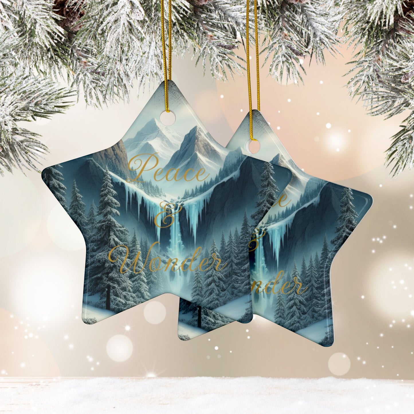 Star-shaped Christmas ornament with mountain and forest design, hanging against a snowy background.