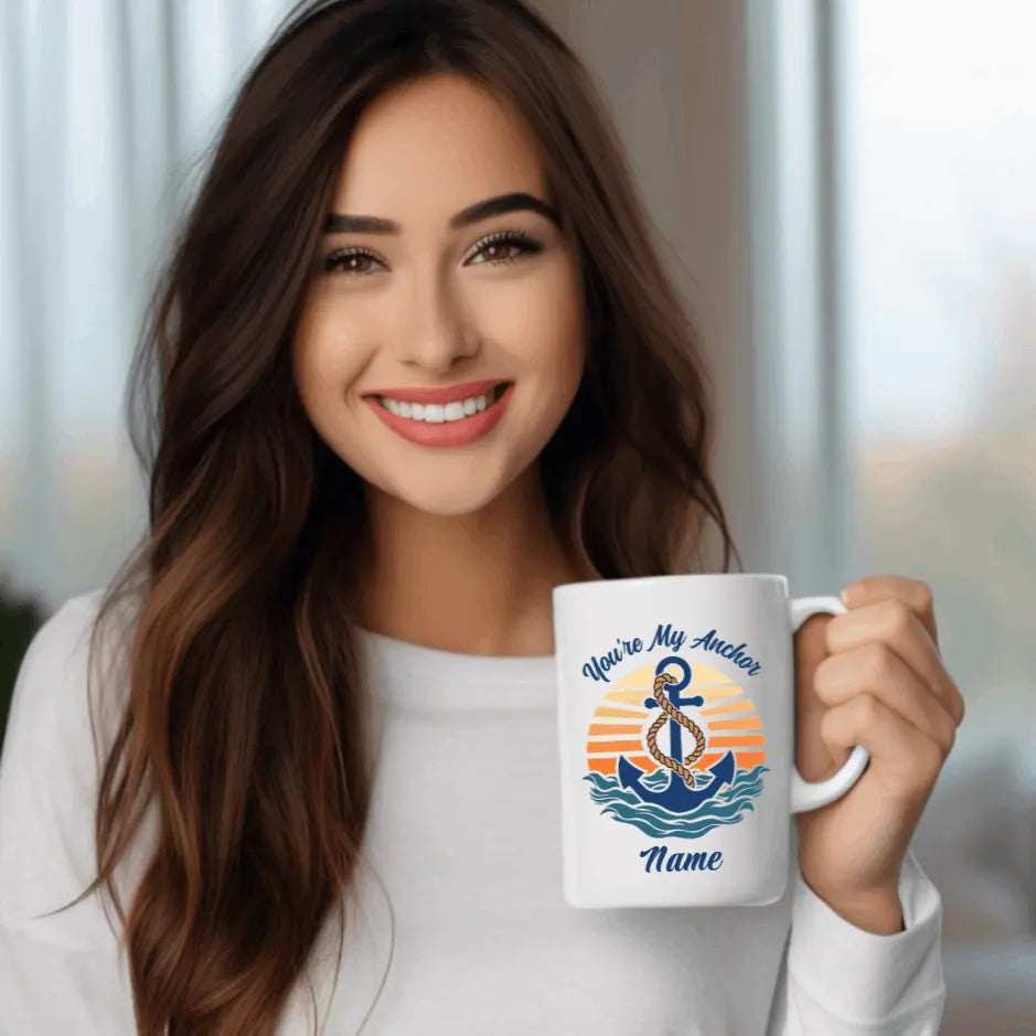 A white ceramic 15 oz mug with an anchor. Retro sunset and waves that says You're My Anchor and personalize with a name.