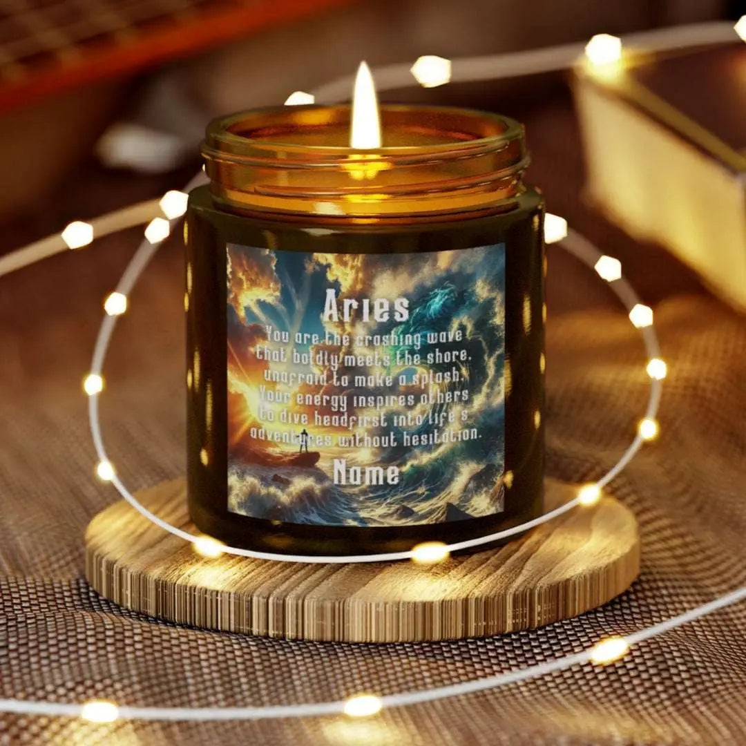 Elegant Cancer Zodiac hand-poured coconut apricot wax scented candle in a 4 oz amber glass jar, featuring a scene of crashing waves with a man in the distance on a rock with the bright sun shining off of the waves and an inspirational quote personalized. A beach-inspired astrology gift, perfect for relaxation and decor.