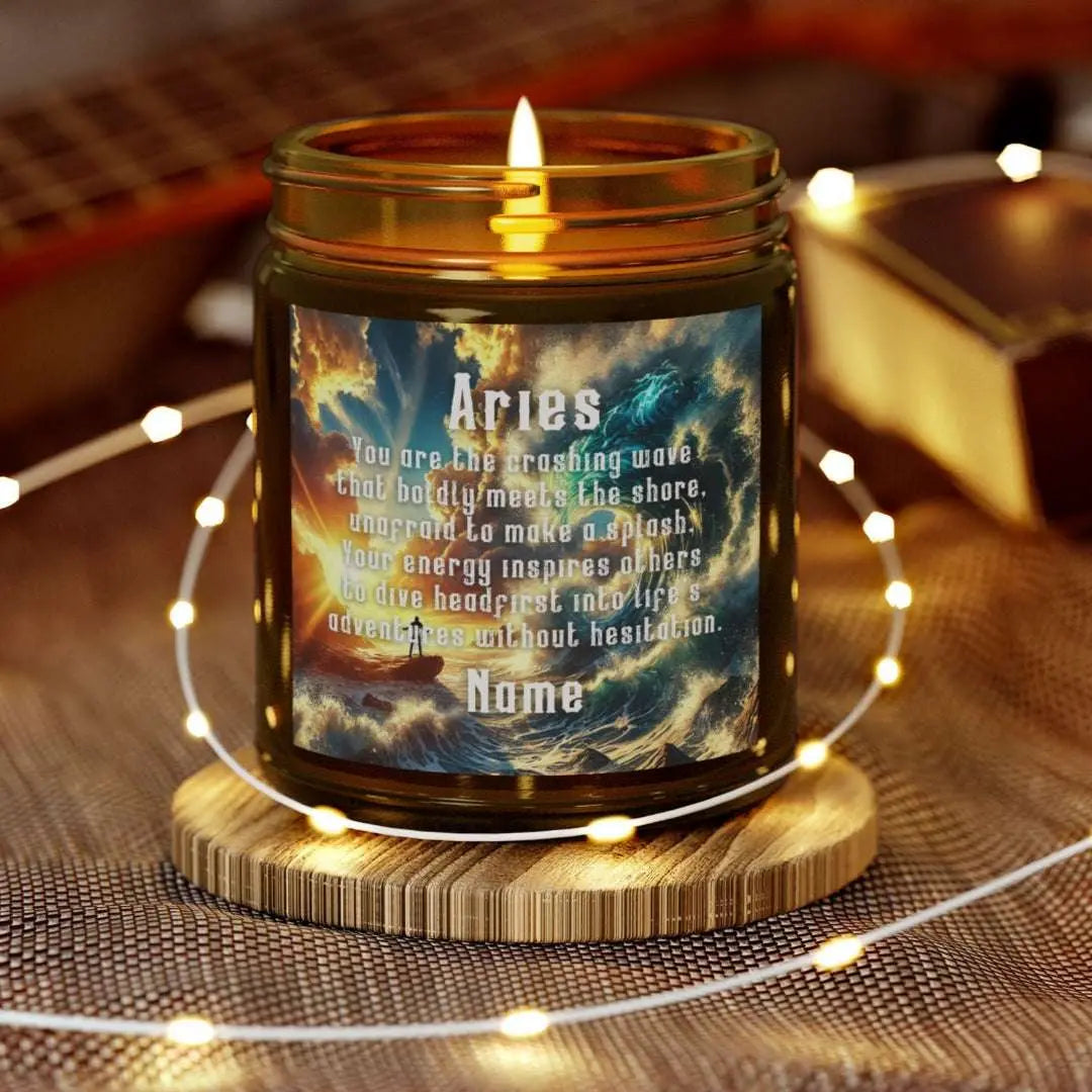 Elegant Cancer Zodiac hand-poured coconut apricot wax scented candle in a 9 oz amber glass jar, featuring a scene of crashing waves with a man in the distance on a rock with the bright sun shining off of the waves and an inspirational quote personalized. A beach-inspired astrology gift, perfect for relaxation and decor.