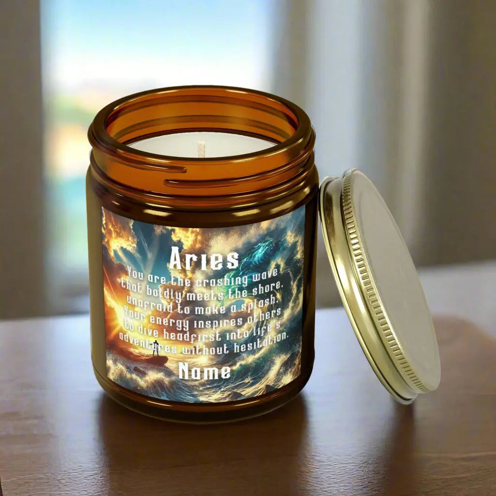 Elegant Cancer Zodiac hand-poured coconut apricot wax scented candle in a 9 oz amber glass jar with glass lid, featuring a scene of crashing waves with a man in the distance on a rock with the bright sun shining off of the waves and an inspirational quote personalized. A beach-inspired astrology gift, perfect for relaxation and decor.