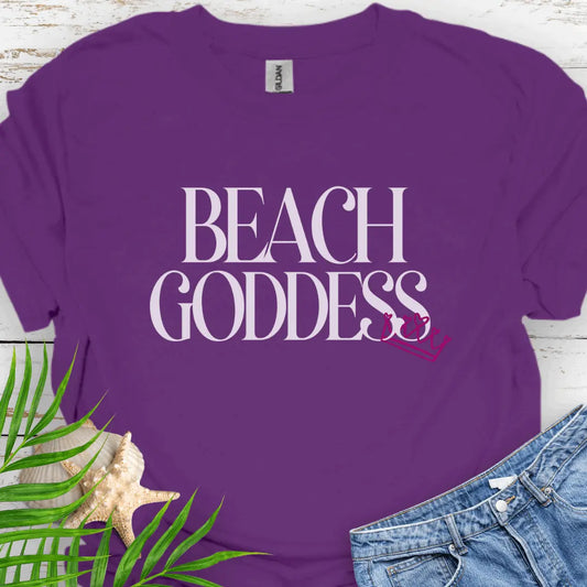 Purple T-Shirt with the text Beach Goddess with a crown hanging off of the bottom of the text -stylish tee is great for vacations, beach days, or casual wear.