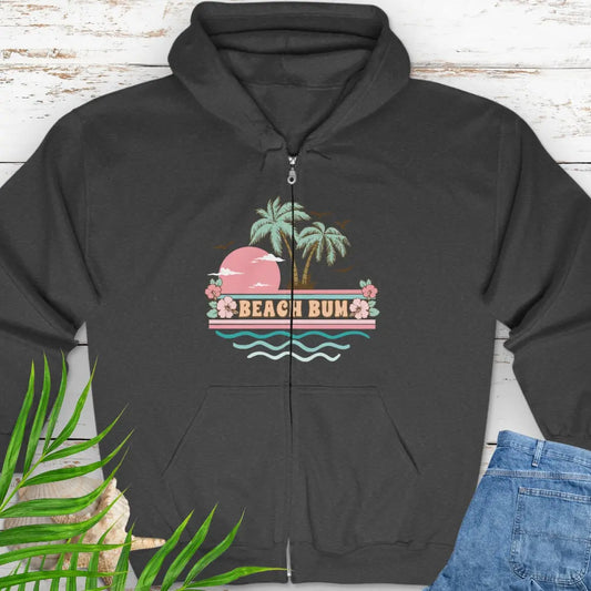 A pastel retro beach scene that says Beach Bum Dark Heather zippered sweatshirt with hood.