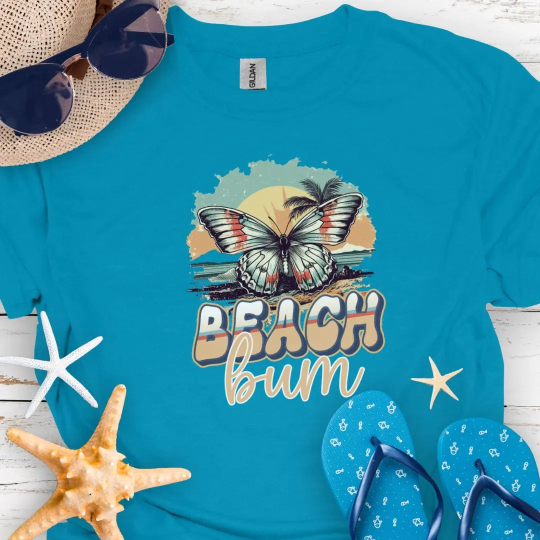 Tahiti Blue t-shirt with butterfly in sunset with text Beach Bum.
