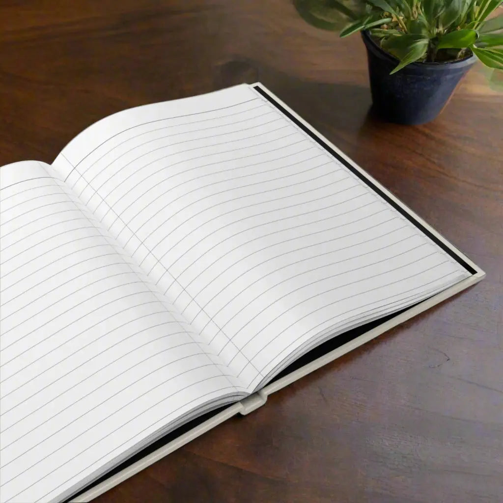 Hardcover Journal open with white lined perforated paper.