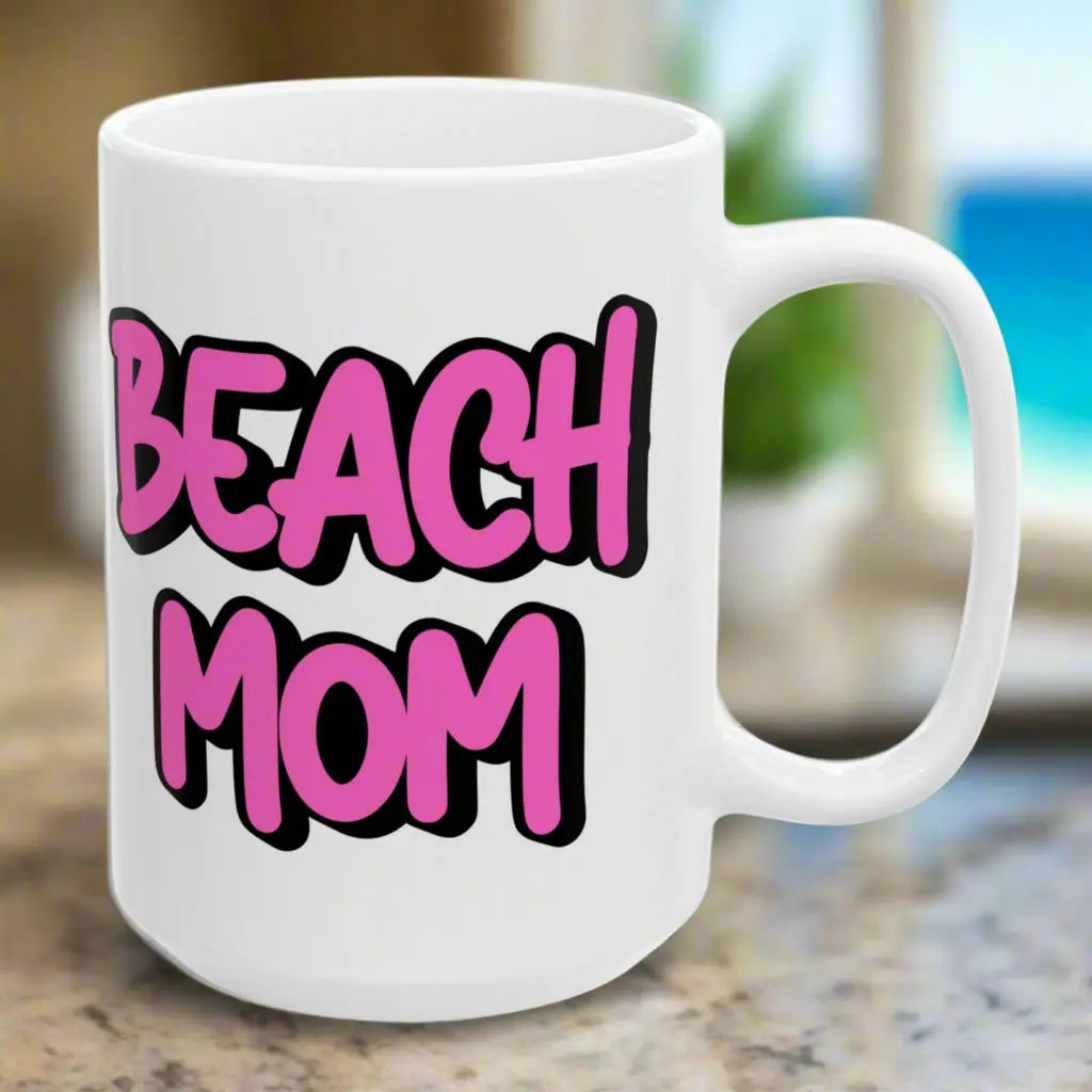 White 15 oz mug with a bright hot pink with black outline text Beach Mom.