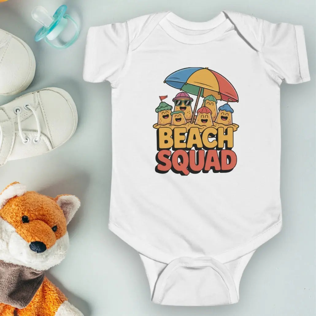 White 'Beach Squad' Infant Bodysuit featuring a playful design of sand castle people under a big beach umbrella.
