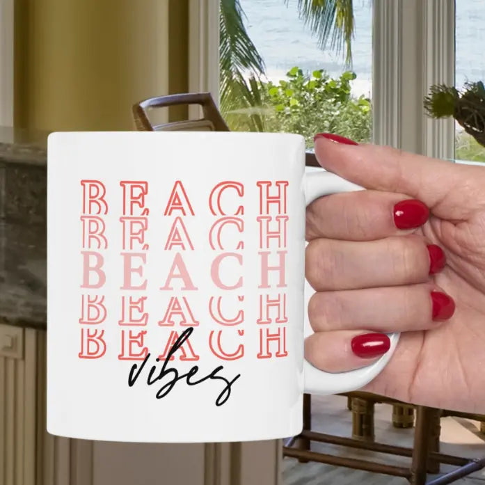 White 11 oz. Mug with Beach Repeated 5 times and Vibes written at bottom.