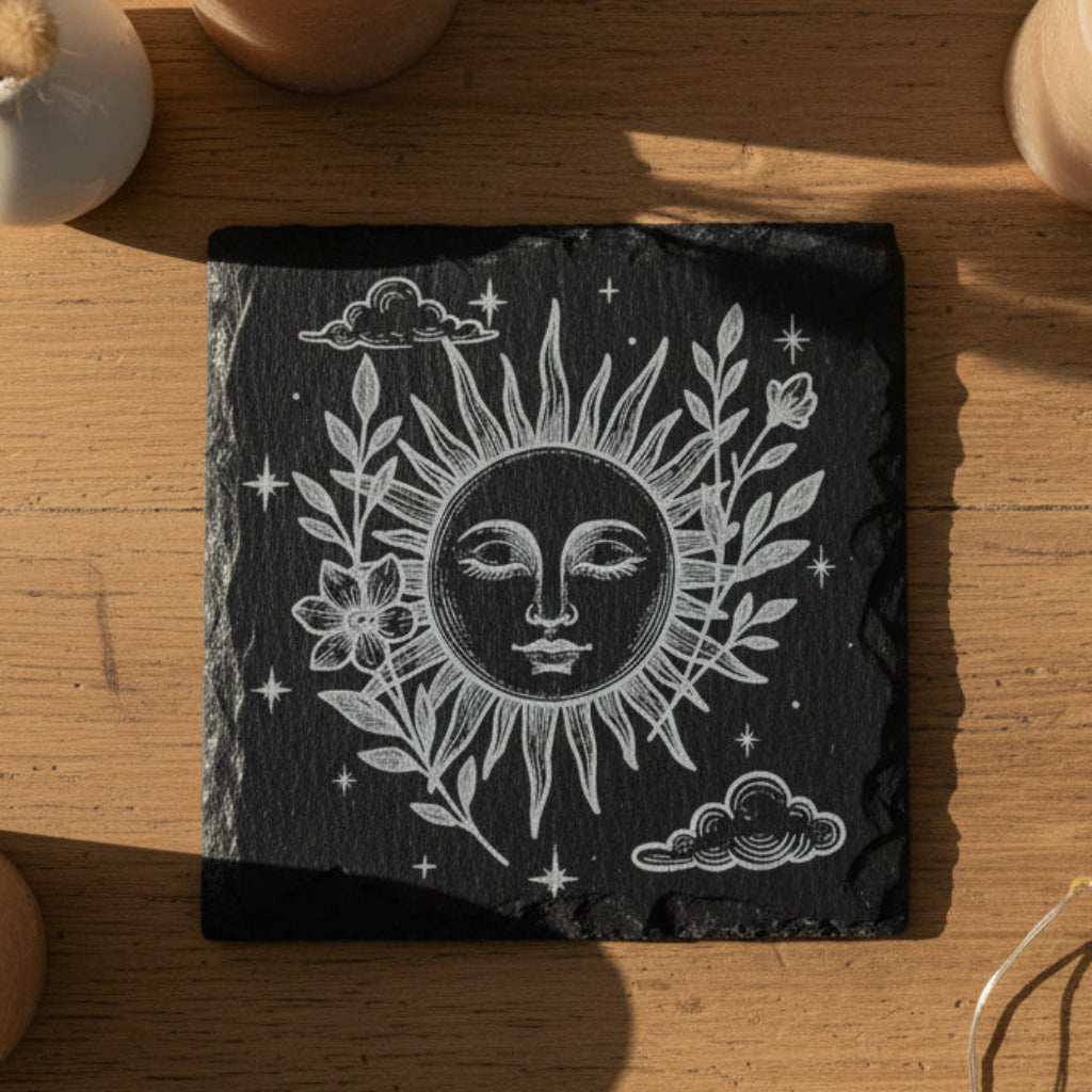 Decorative slate with celestial sun and moon boho design.
