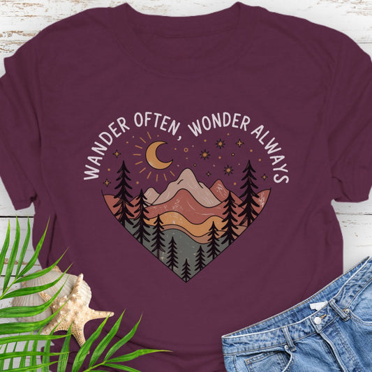 Maroon Unisex t-shirt with mountain and trees in a heart shape and the phrase "Wander Often, Wonder Always".