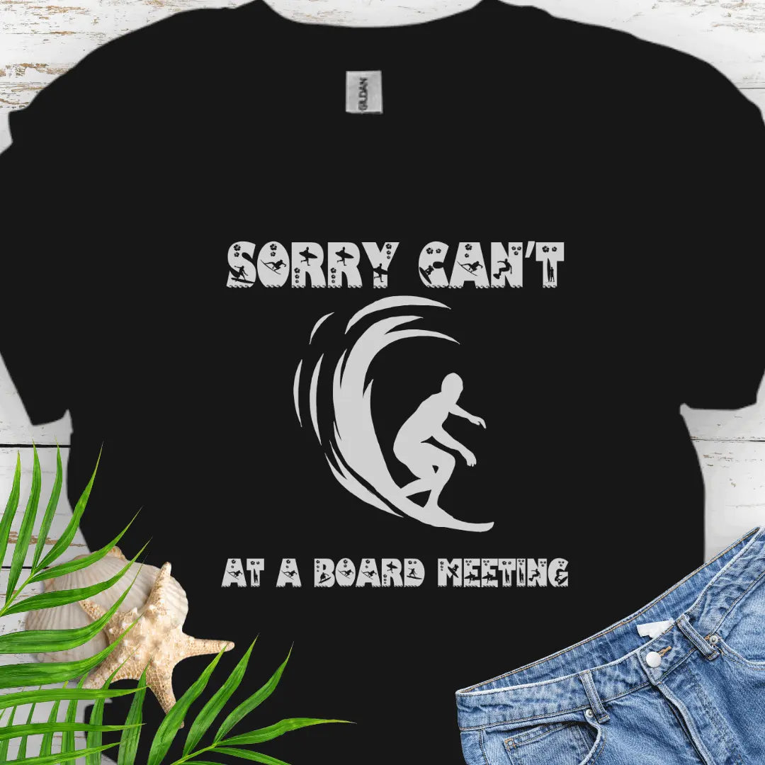 Black t-shirt with a surfer and says Sorry Can't Board Meeting - ideal for beach vacations, casual Fridays, and surfing enthusiasts.