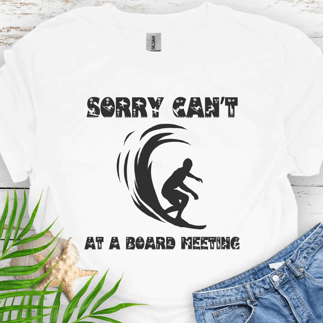 White t-shirt with a surfer and says Sorry Can't Board Meeting - ideal for beach vacations, casual Fridays, and surfing enthusiasts.
