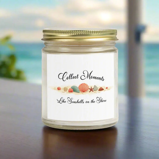 Elegant hand-poured coconut apricot wax scented candle in a 9 oz clear glass jar, featuring the quote "Collect Moments Like Seashells on the Shore" with a seashell design. A cozy beach-inspired gift, perfect for relaxation and decor.