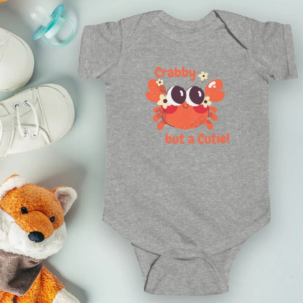 Heather Gray short sleeved body suit with cartoon crab that says crabby but a cutie.