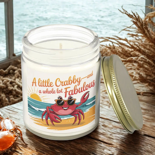 A Little Crabby and A hole Lot Fabulous 9 oz clear candle with a sexy crab wearing glasses on the beach.
