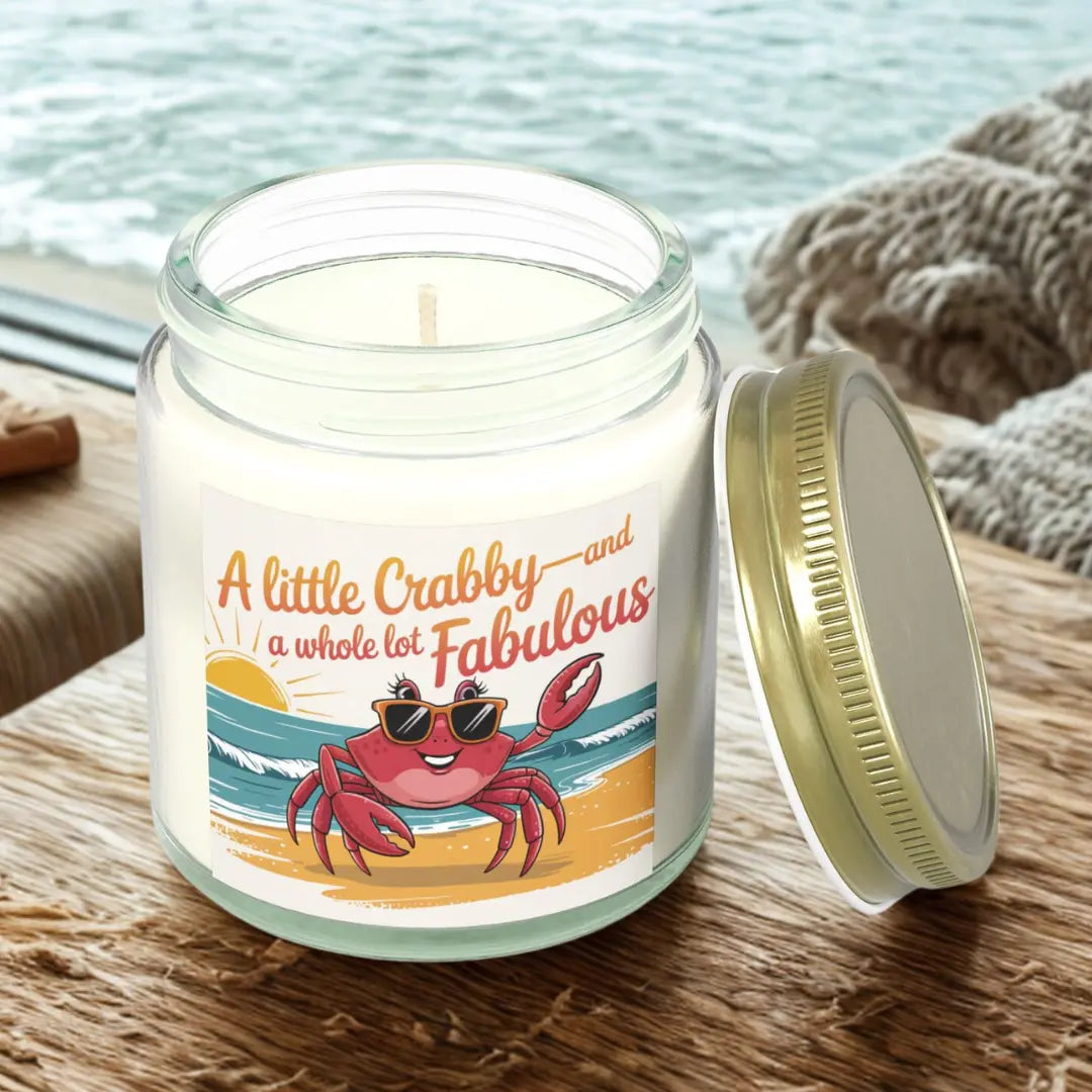 A Little Crabby and A hole Lot Fabulous 4 oz clear candle with a sexy crab wearing glasses on the beach.