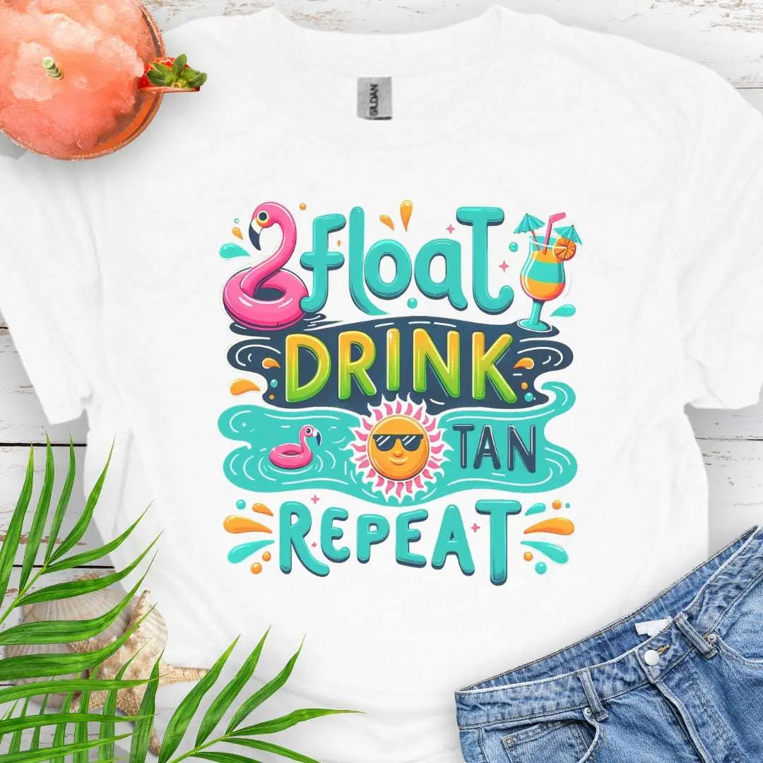 Our Float Drink Tan Repeat White T-shirt is the ultimate vibe for sun-lovers and poolside chillers! Featuring a fun and colorful design with a flamingo floaty, tropical cocktail, and a cool sun rocking shades, this tee screams vacation mode.