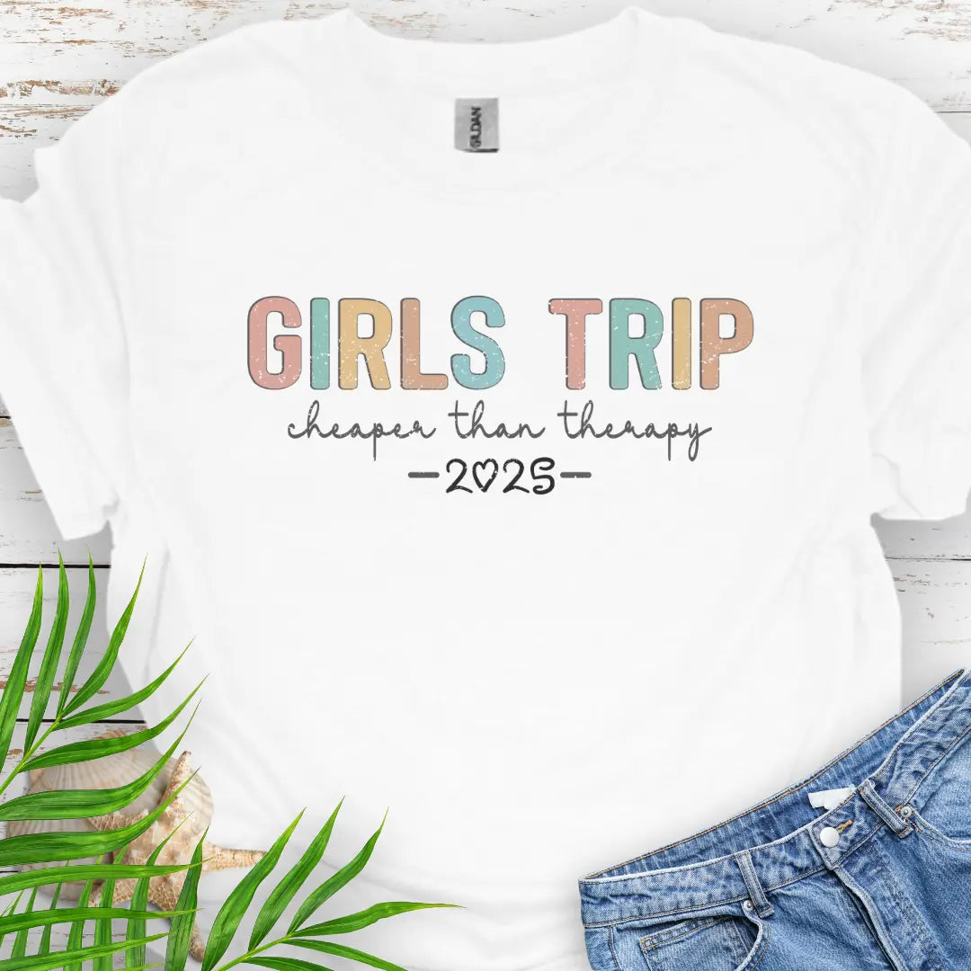 White Girl’s Trip T-shirt with colorful grunge text, "Cheaper Than Therapy," and a customizable year. Perfect for group trips, fun getaways, and lasting memories.