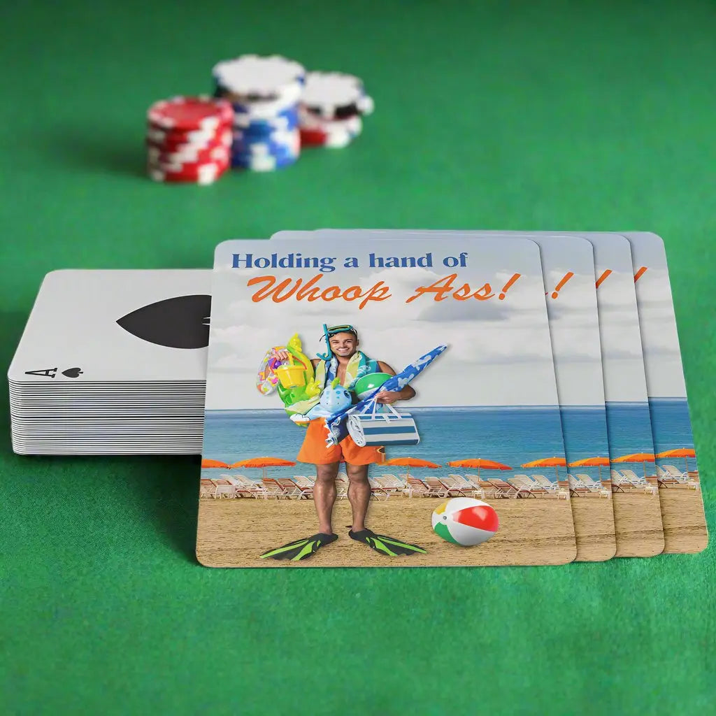 Playing cards with the image of a man holding a bunch or beach gear with swimming fins on this feet at the beach with the text Holding a hand of whoop ass.