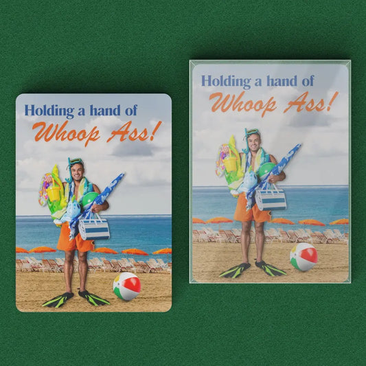 Playing cards with the image of a man holding a bunch or beach gear with swimming fins on this feet at the beach with the text Holding a hand of whoop ass. with plastic case.
