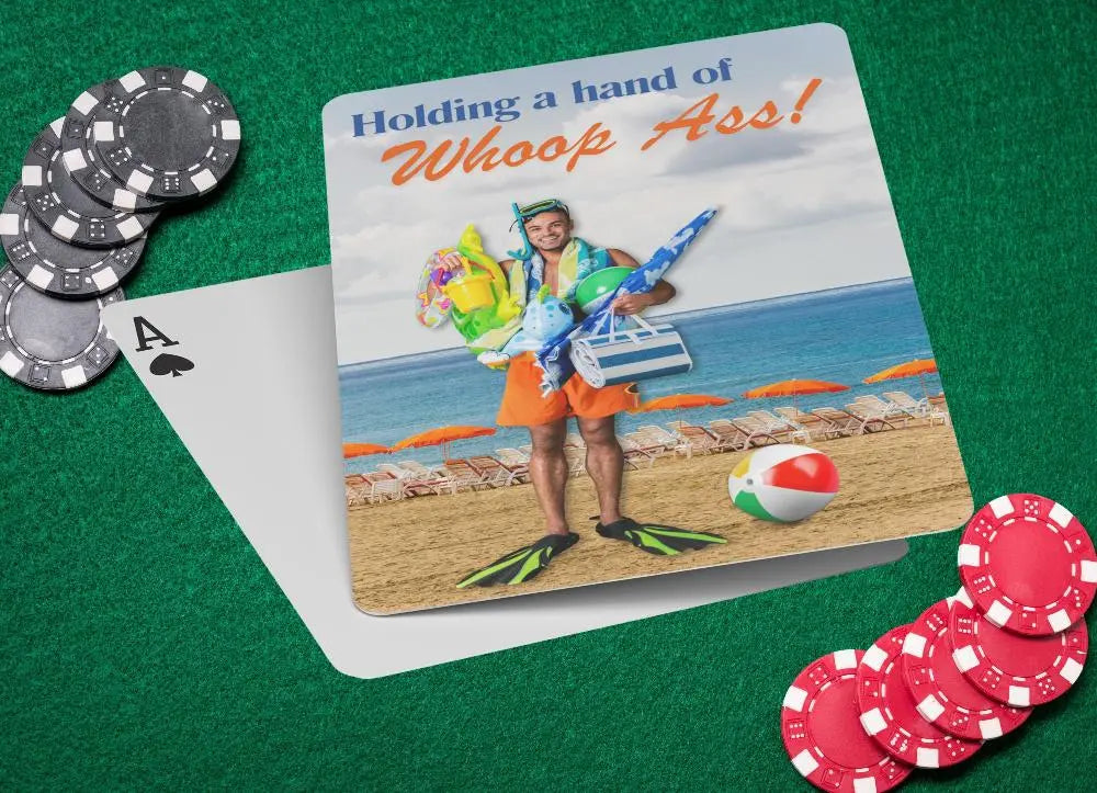 Playing cards with the image of a man holding a bunch or beach gear with swimming fins on this feet at the beach with the text Holding a hand of whoop ass.