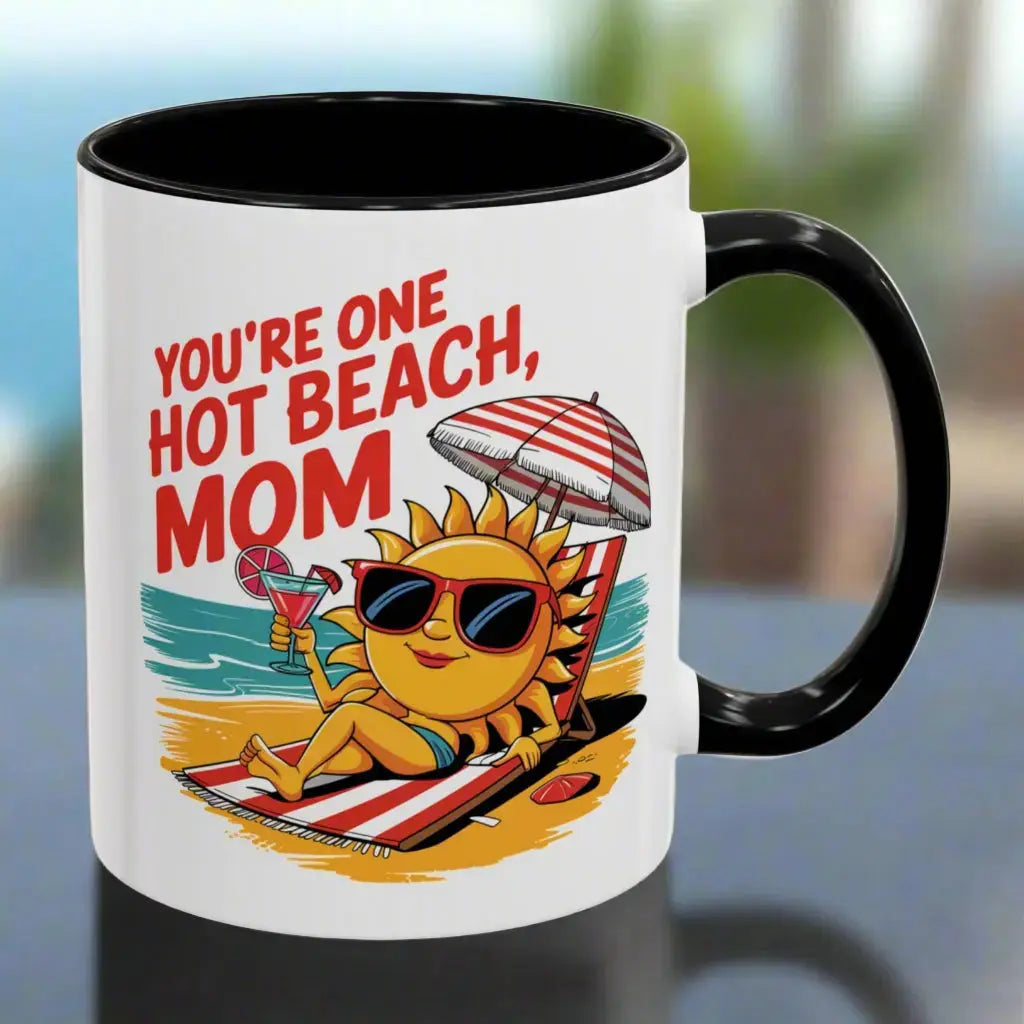 A white 11 oz mug with a black handle and inside with a sexy sun laying on a beach towel holding a drink on the beach that says You're One Hot Beach Mom.