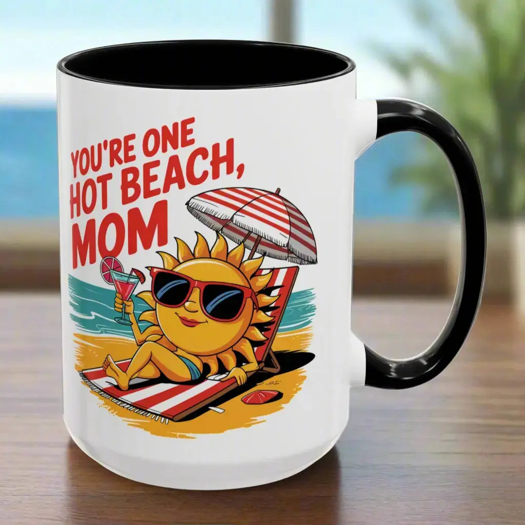 A white 15 oz mug with a black handle and inside with a sexy sun laying on a beach towel holding a drink on the beach that says You're One Hot Beach Mom.