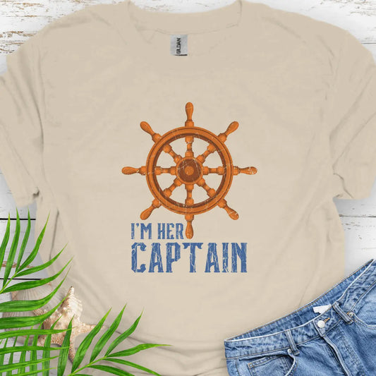 Natural T-shirt featuring a bold ship wheel design and the text 'I'm Her Captain' – nautical couples apparel, beach-themed gift, coastal style t-shirt.
