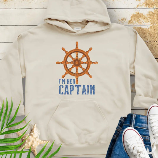 Natural hoodie featuring a bold ship wheel design and the text 'I'm Her Captain' – nautical couples apparel, beach-themed gift, coastal style hoodie.
