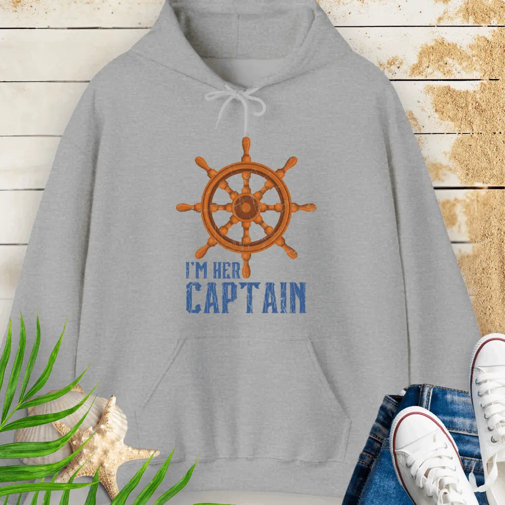 Sport Grey hoodie featuring a bold ship wheel design and the text 'I'm Her Captain' – nautical couples apparel, beach-themed gift, coastal style hoodie.