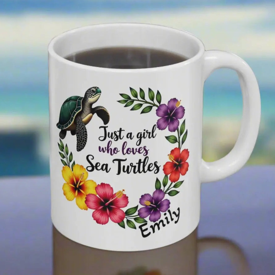 A white ceramic mug 11 0z. with a wreath of hibiscus flowers and a swimming sea turtle with text Just a girl who loves Sea Turtles and can be personalized with name.